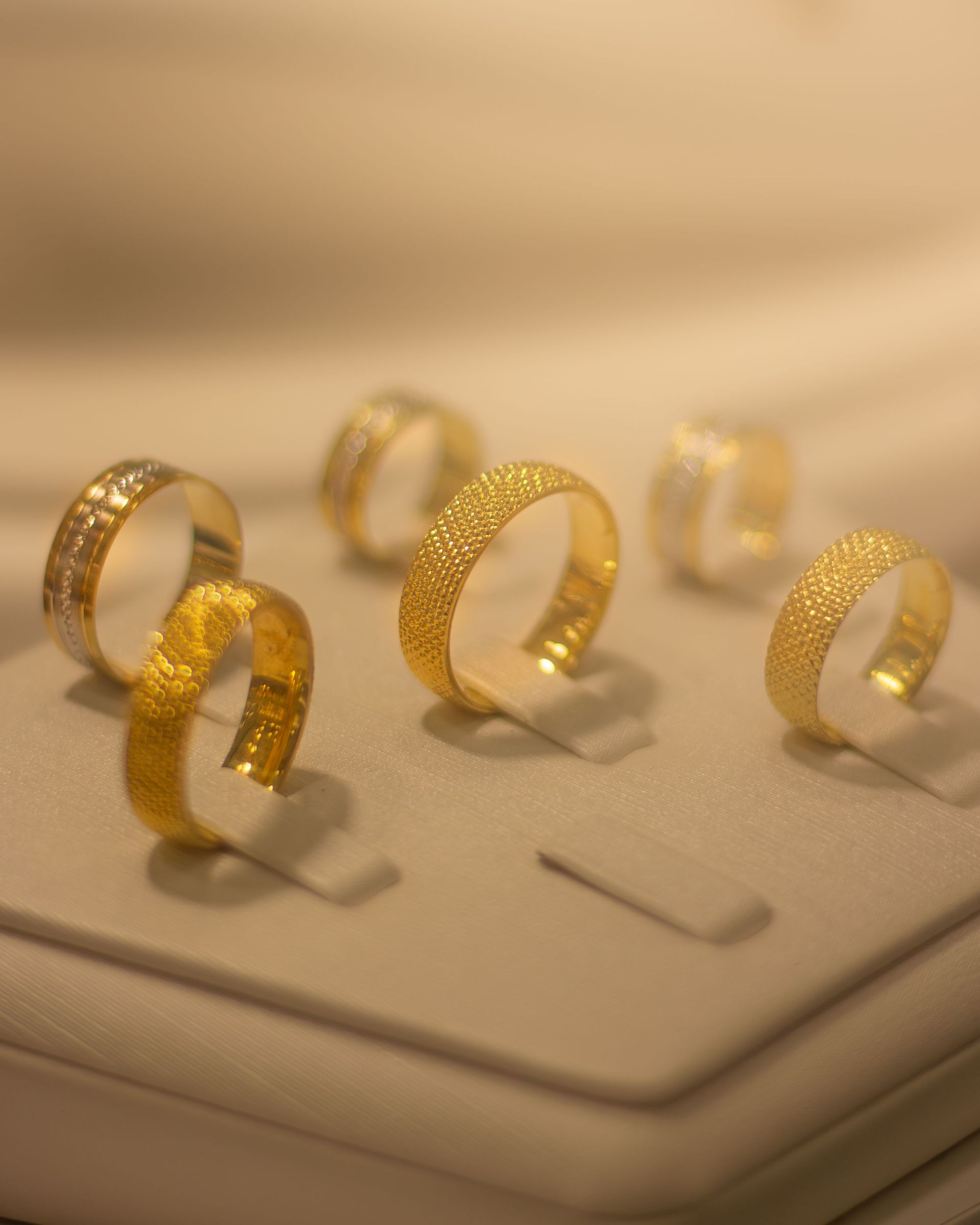 Luxurious gold rings displayed elegantly, perfect for weddings and special occasions.